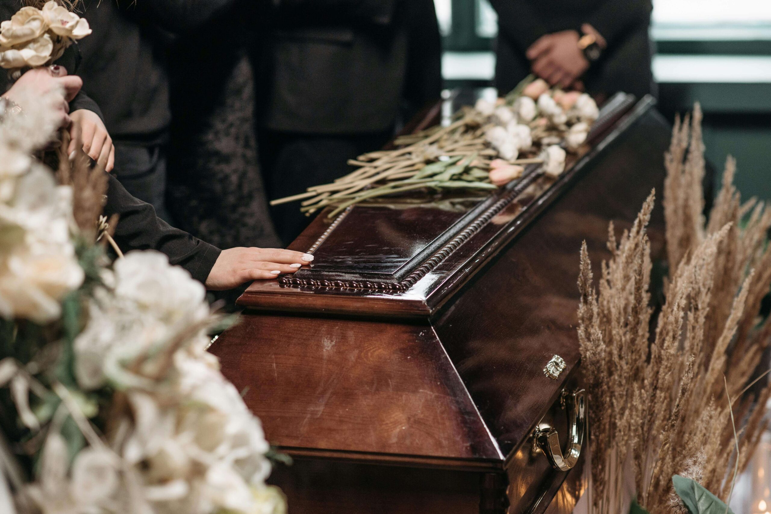 La Vergne wrongful death lawyer - hands on funerary box