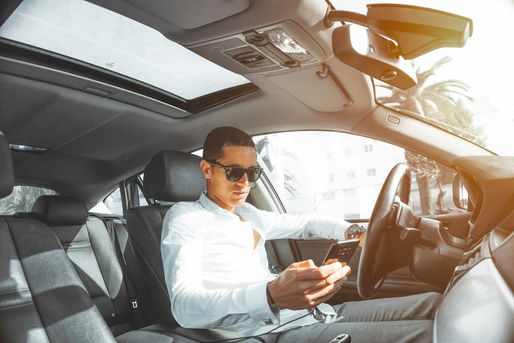 Distracted driver on his phone while driving